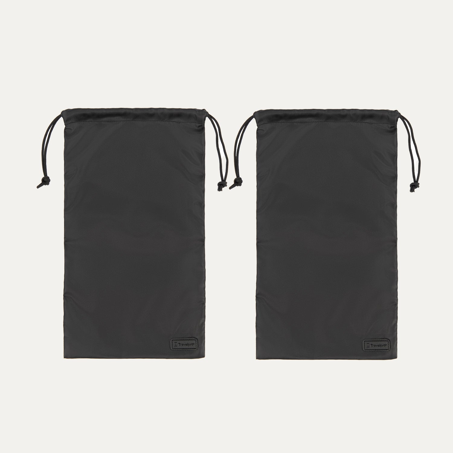 Two black Travelpro drawstring shoe bags made from lightweight fabric, each featuring a pull cord closure at the top and a small Travelpro logo tag at the bottom corner.