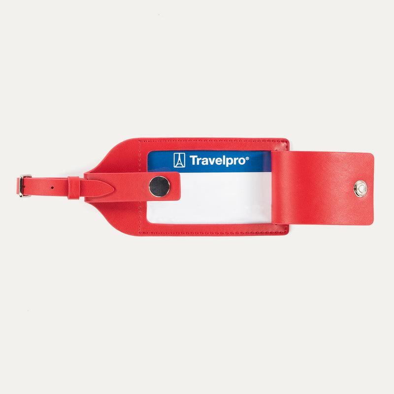 Open view of Travelpro Essentials Leather Luggage Tag in Red, with ID window and snap-closure privacy flap.