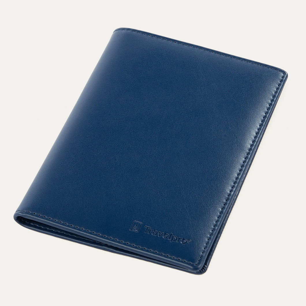 Travelpro® Passport Cover in navy, crafted from smooth leather with fine stitching along the edges and an embossed Travelpro® logo at the bottom corner