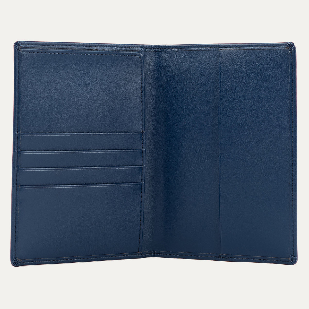 Interior view of a navy blue Travelpro passport cover, featuring multiple card slots on the left and a large pocket on the right for securely holding a passport.