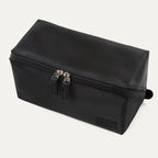 Front angled view of the Travelpro® MaxAccess Cubes™ Toiletry Organizer in black with dual zippers and a structured rectangular design.
