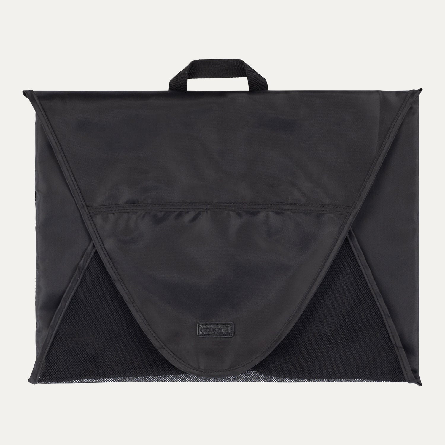 A black Travelpro Essentials Garment Packing Folder, designed to organize and protect clothing during travel.