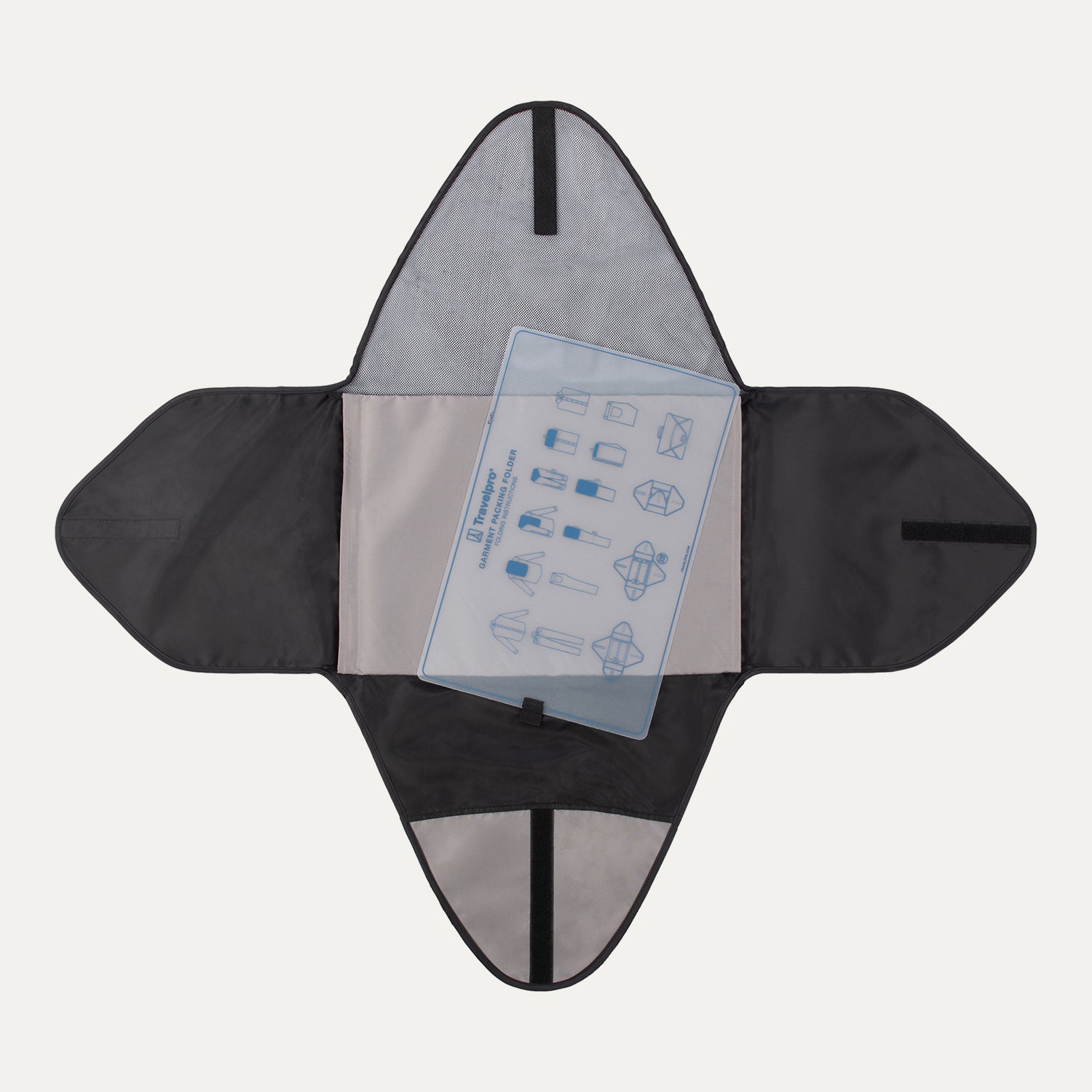 Interior view of Travelpro Essentials Foldable Garment Folder in BLACK, with folding board and illustrated packing guide.
