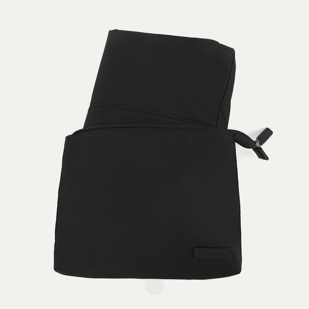 Close-up view of the Travelpro Essentials SparePack Foldable Tote 2.0 in Black, showing the bag fully packed and zipped into its compact, flat storage pouch, highlighting the embossed Travelpro branding on the front.