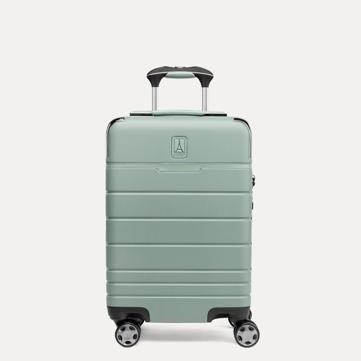 Front view of T+L Carry-On Spinner in Center Sage Green, showing a smooth shell with horizontal grooves and black wheels 