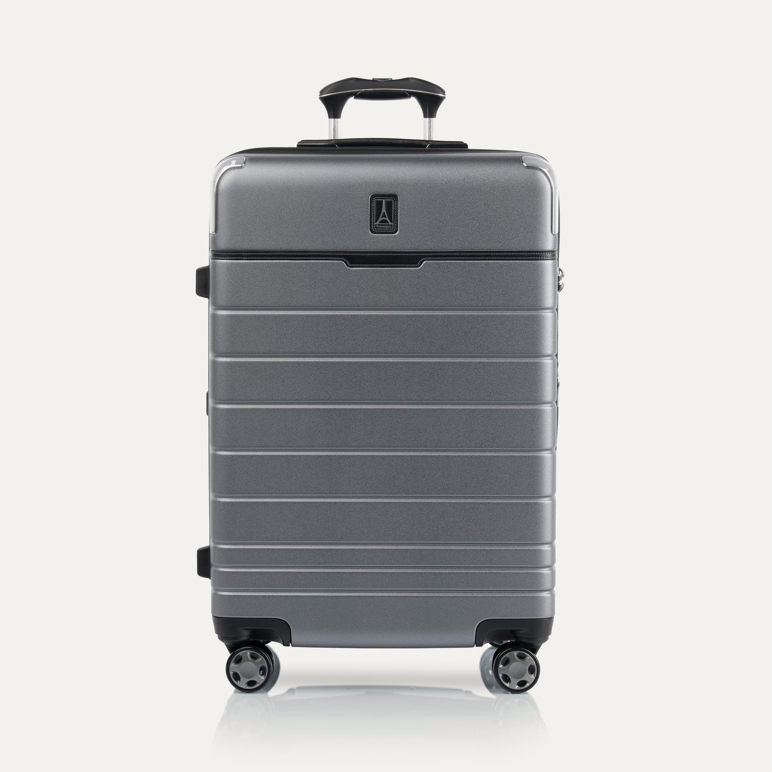Front view of Travel + Leisure® Medium Check-In Expandable Spinner in Whistler Grey, with textured hard shell, black trim, and dual spinner wheels.
