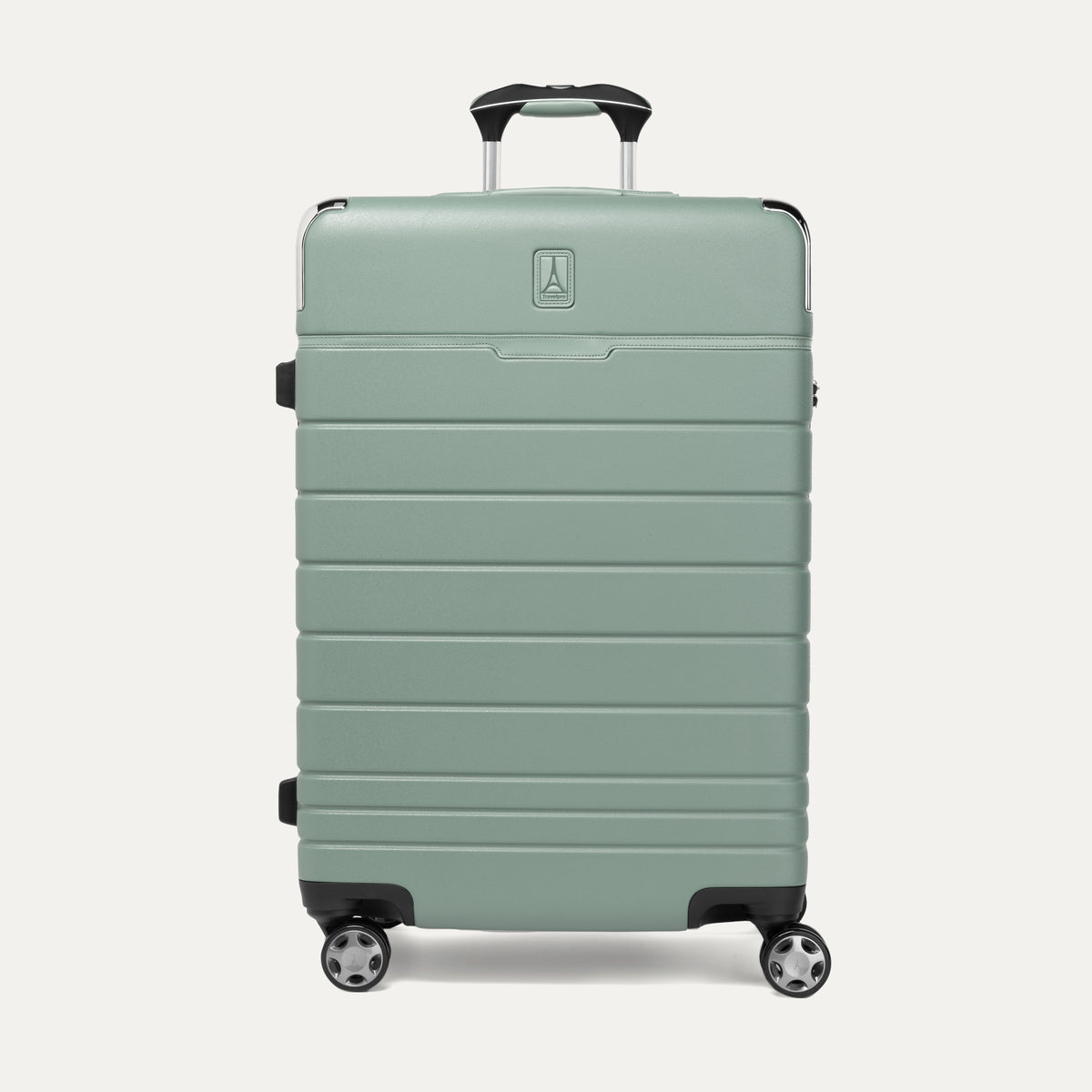 Front view of T+L Medium Check-In Spinner in Center Sage Green, showing a sleek hard shell with horizontal grooves and dual spinner wheels.
