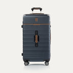 Front view of Travel + Leisure® Large Check-In Expandable Spinner in Monaco Blue, with textured hard shell, contrast brown trim, and dual spinner wheels.