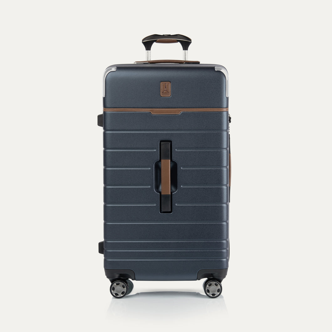 Front view of Travel + Leisure® Large Check-In Expandable Spinner in Monaco Blue, with textured hard shell, contrast brown trim, and dual spinner wheels.