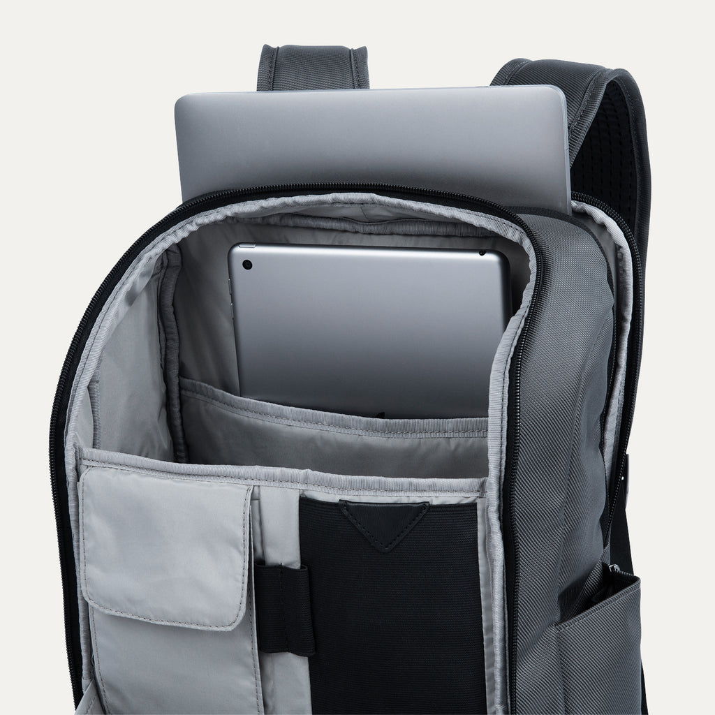 Interior view of the Crew Executive Choice 3 Slim Laptop Backpack in Titanium Grey, highlighting the dedicated, padded storage compartments for a laptop and a tablet, showcasing the bag's organized design.