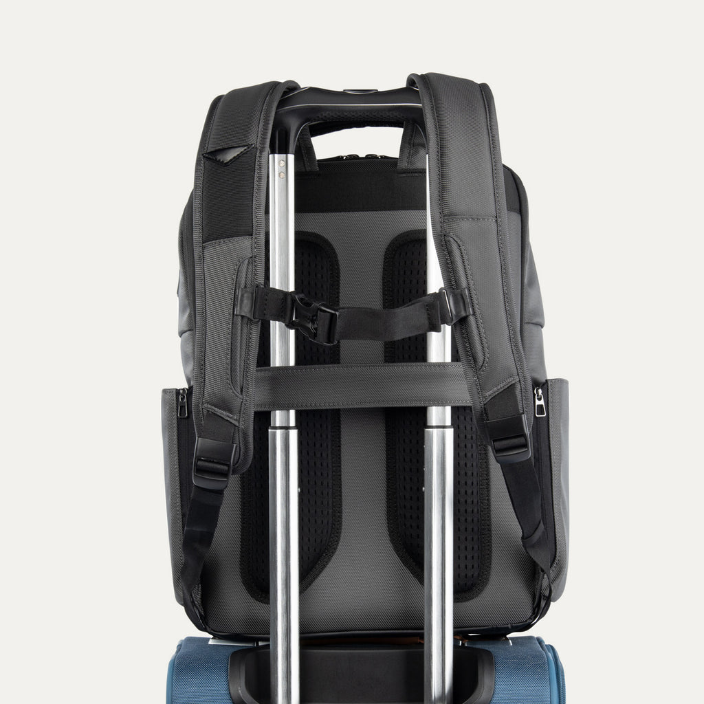 Rear view of the Crew Executive Choice 3 Large Travel Backpack in Titanium Grey, showcasing the ergonomic airflow back panel, adjustable shoulder straps, and the integrated rear stacking strap designed for secure, hands-free mobility on roller luggage.