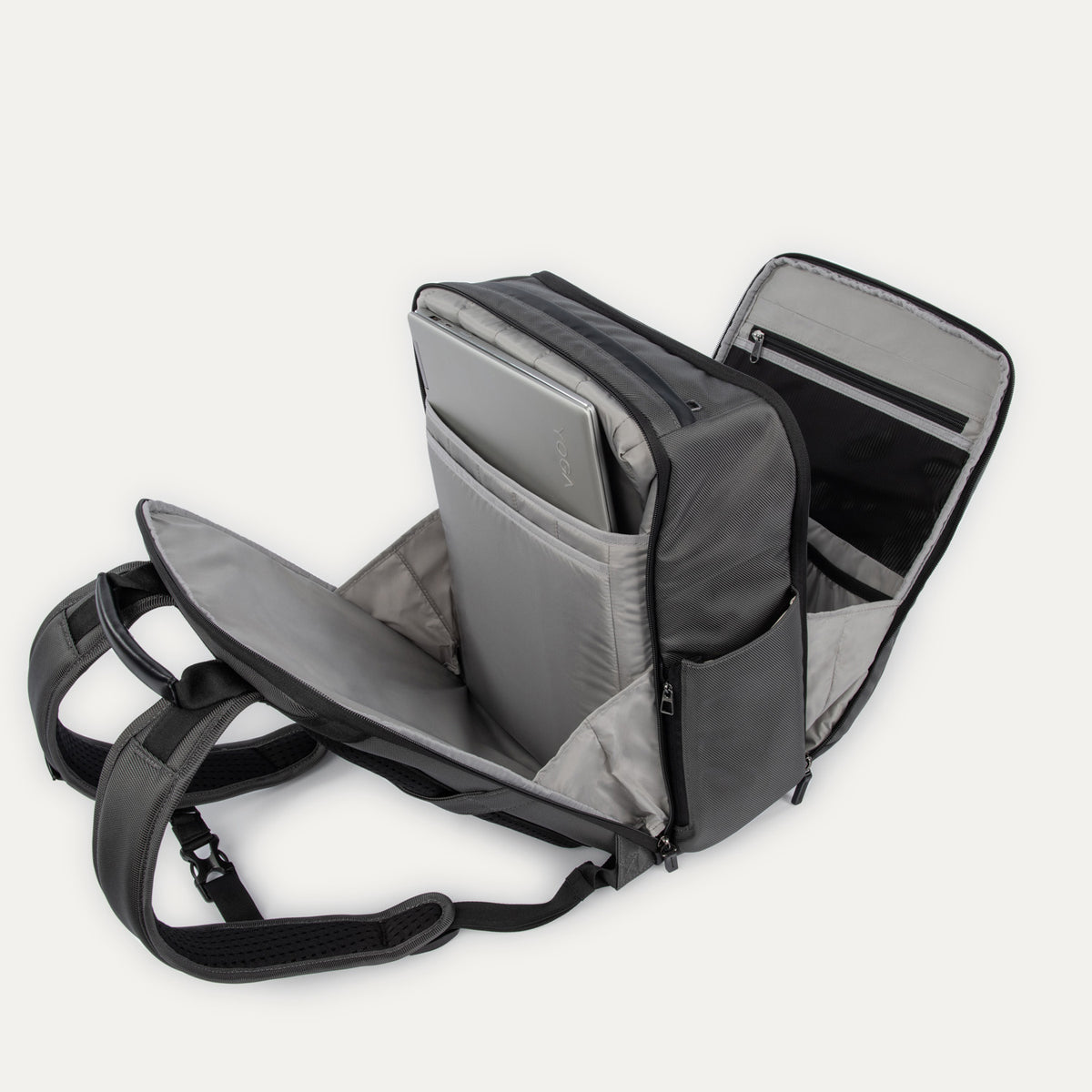 Interior detail view of the Crew Executive Choice 3 Large Travel Backpack in Titanium Grey, showcasing the dedicated, padded laptop and tablet sleeves designed to secure electronics with easy access.