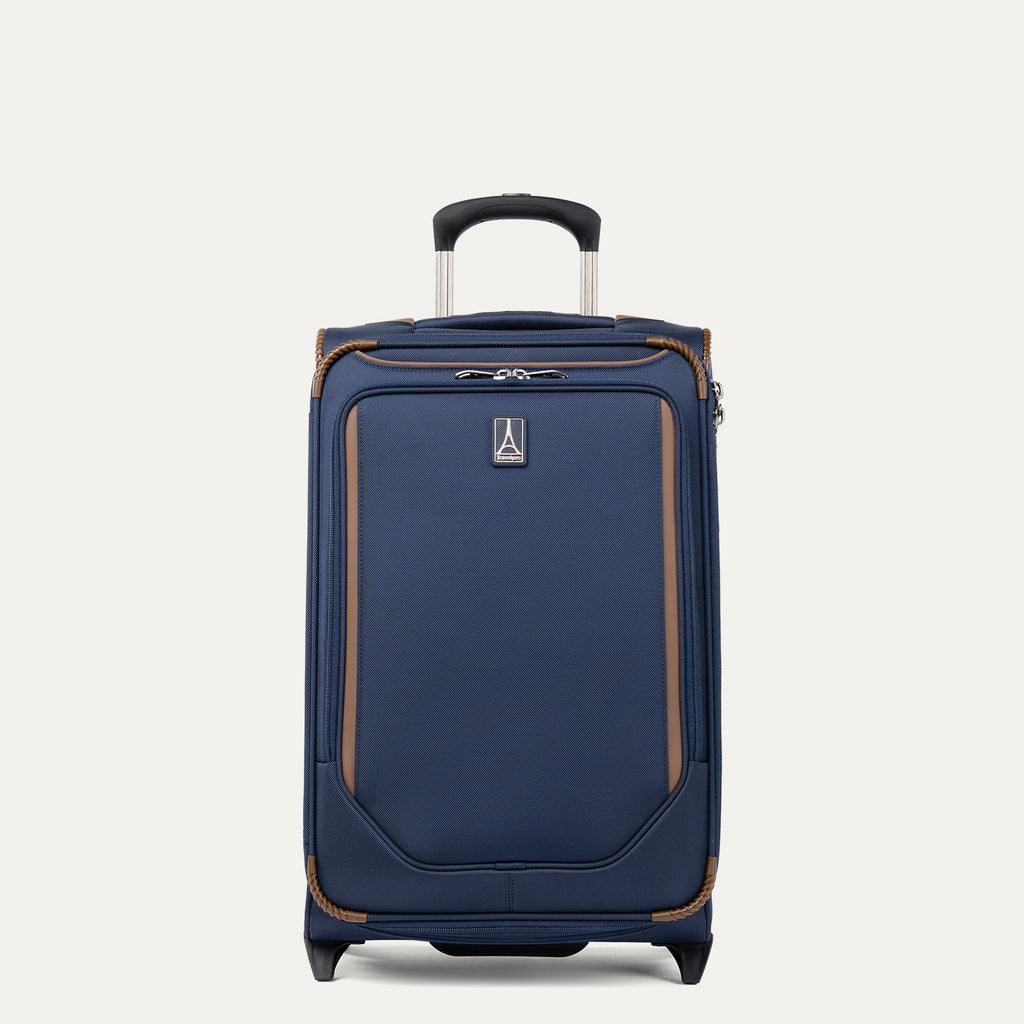 Front view of Travelpro Crew Classic Carry-On Rollaboard in Patriot Blue, featuring reinforced corners and PowerScope Lite Handle.