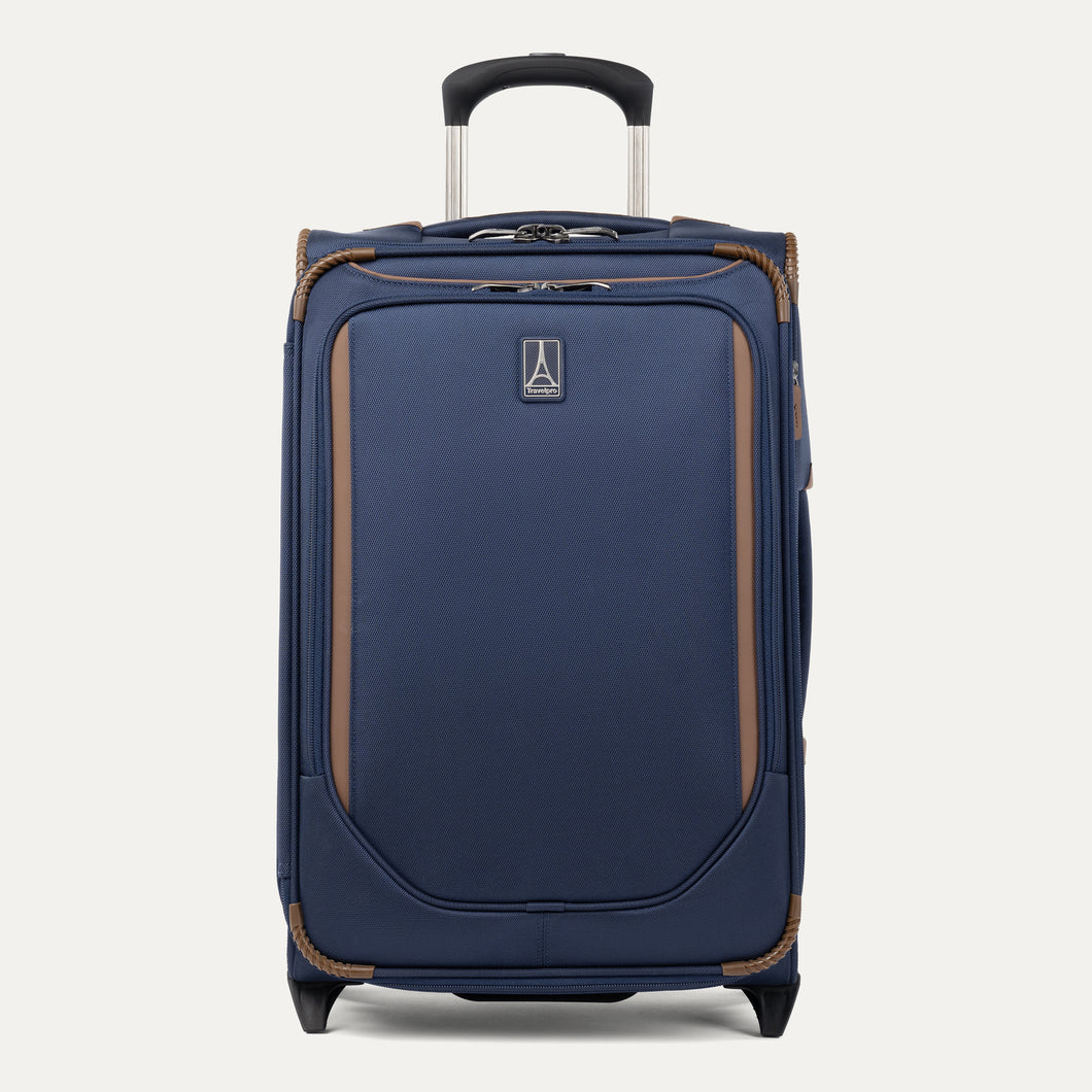 Front view of Travelpro Crew Classic Carry-On Rollaboard in Patriot Blue, featuring reinforced corners and PowerScope Lite Handle.
