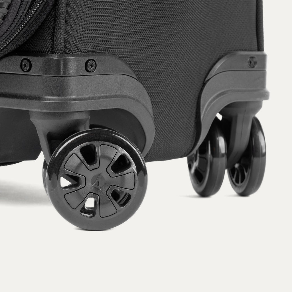 Close-up of the Travelpro Crew Classic  Spinner in Black, highlighting the 360° Spinner Wheels.
