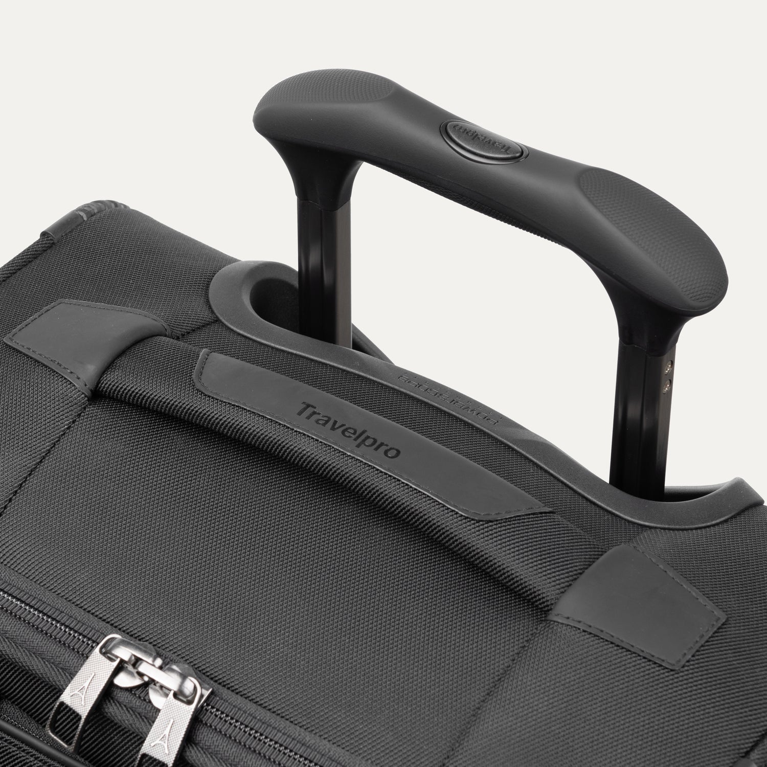 Close-up of the PowerScope Extension Handle with Contour Grip on the Travelpro Crew Classic Spinner in Black.
