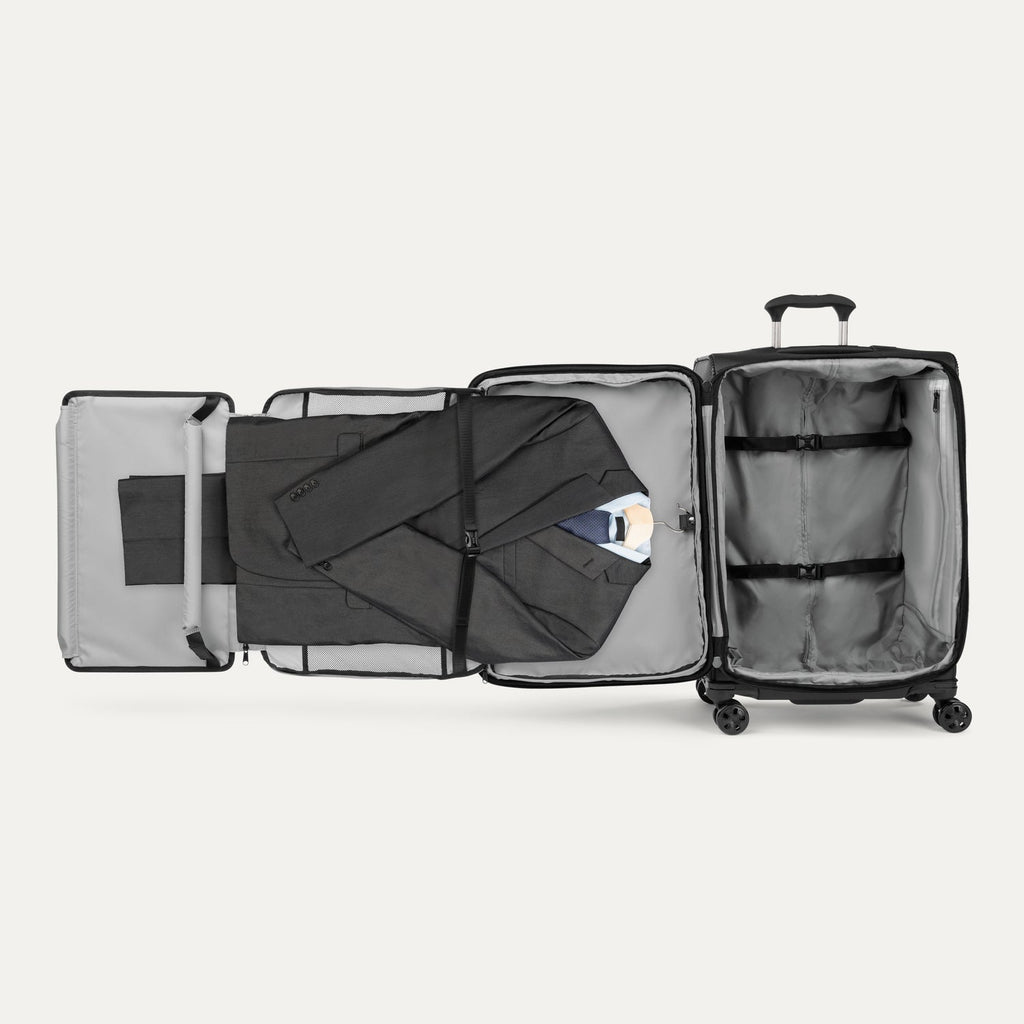 Interior of Travelpro Crew Classic suitcase in Black, featuring Suiter Packing System and adjustable hold-down straps.