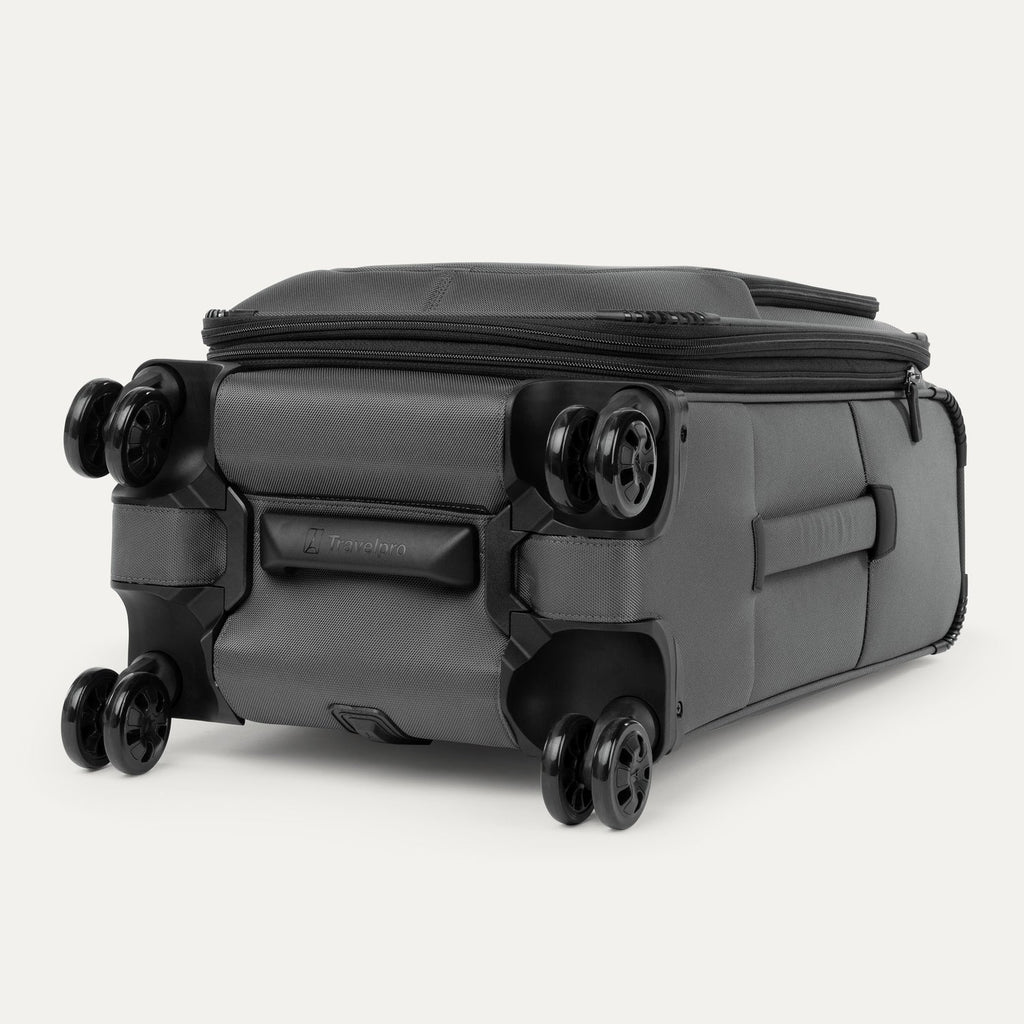 Bottom view of the Travelpro Crew Classic Carry-On Spinner in Titanium Grey, designed for durability with dual spinner wheels.