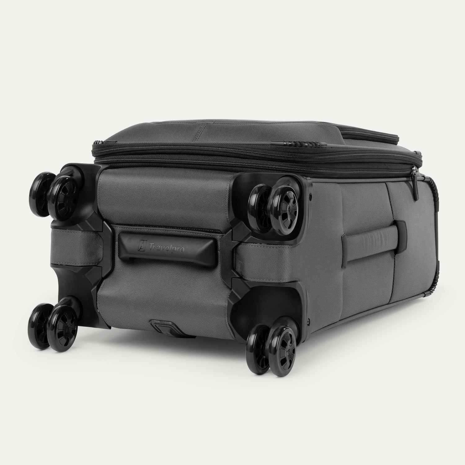 Bottom view of the Travelpro Crew Classic Carry-On Spinner in Titanium Grey, designed for durability with dual spinner wheels.