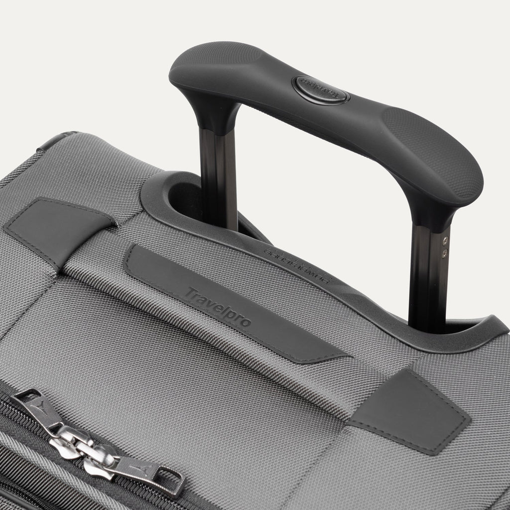 Close-up of the PowerScope Extension Handle with Contour Grip on the Travelpro Crew Classic Spinner in Titanium Grey.
