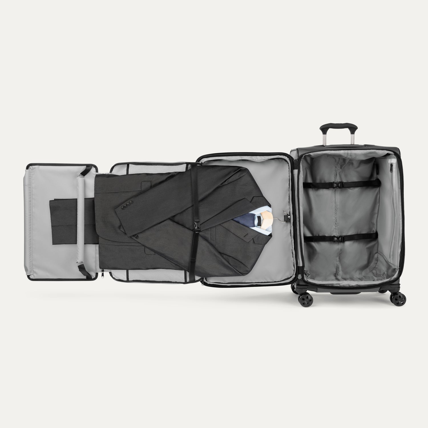 Interior of Travelpro Crew Classic suitcase in Black, featuring Suiter Packing System and adjustable hold-down straps.
