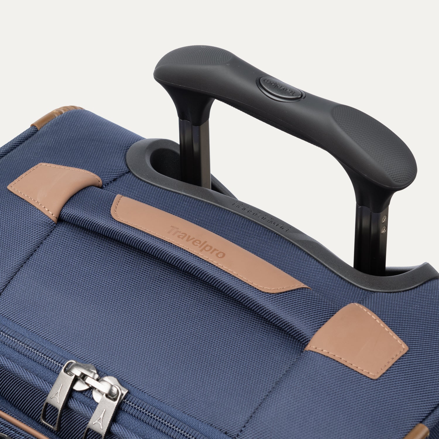Close-up of the Contour Grip and PowerScope Extension Handle on the Travelpro Crew Classic Carry-On in Patriot Blue.
