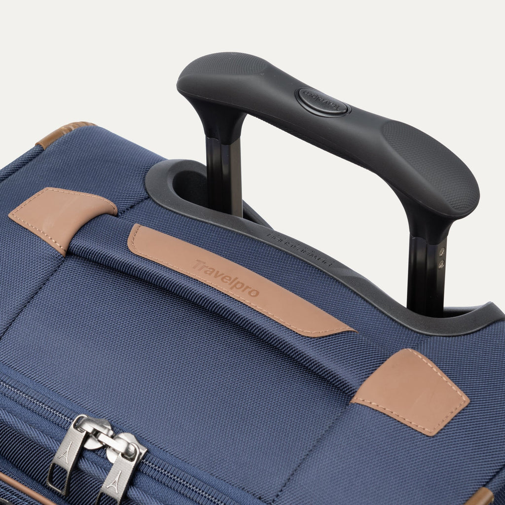 Close-up of the Contour Grip and PowerScope Extension Handle on the Travelpro Crew Classic Carry-On in Patriot Blue.
