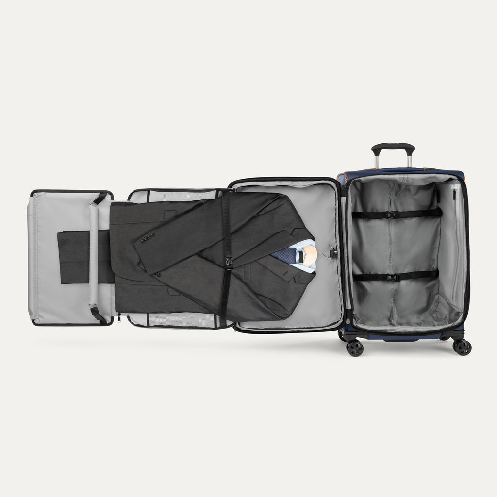 Interior view of the Travelpro Crew Classic Carry-On Spinner in Patriot Blue, featuring a Suiter Packing System.
