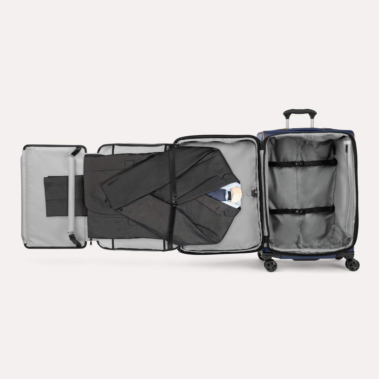 Interior view of the Travelpro Crew Classic Carry-On Spinner in Patriot Blue, featuring a Suiter Packing System.
