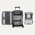 Interior view of the Travelpro Crew Classic Carry-On Spinner in Black, showing Organizational Pouches and adjustable hold-down straps.
