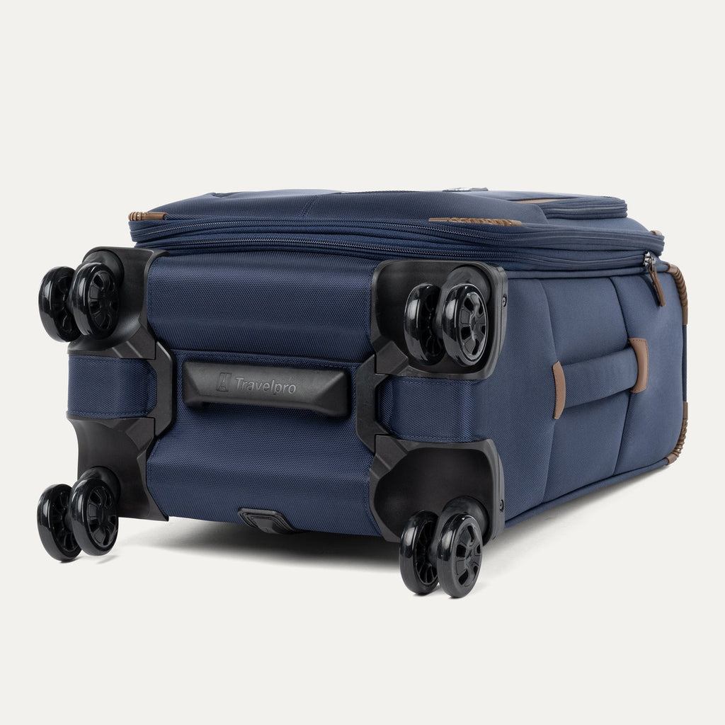 Bottom view of the Travelpro Crew Classic Spinner in Patriot Blue, featuring durable 360° Spinner Wheels 