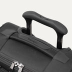 Close-up of a black suitcase handle 