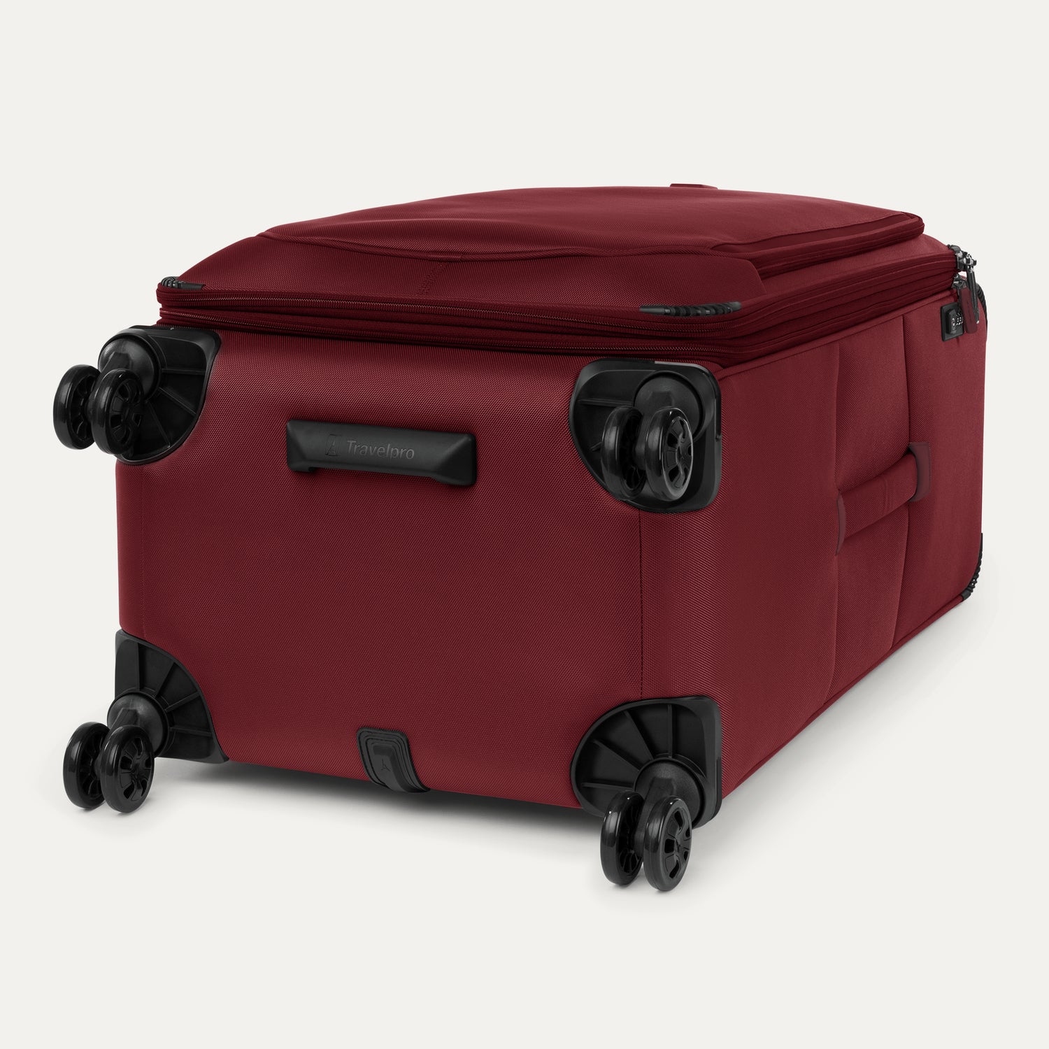 Red suitcase with black wheels on a white background