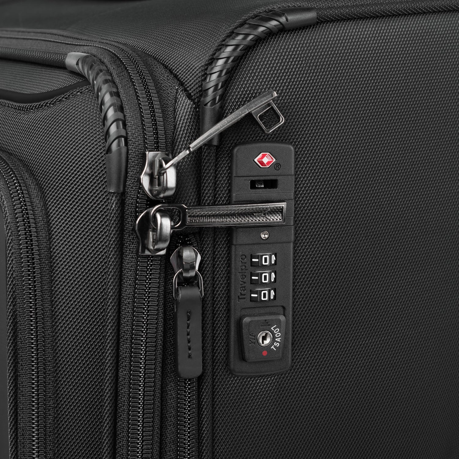 Close-up of a black suitcase with a combination lock on a white background