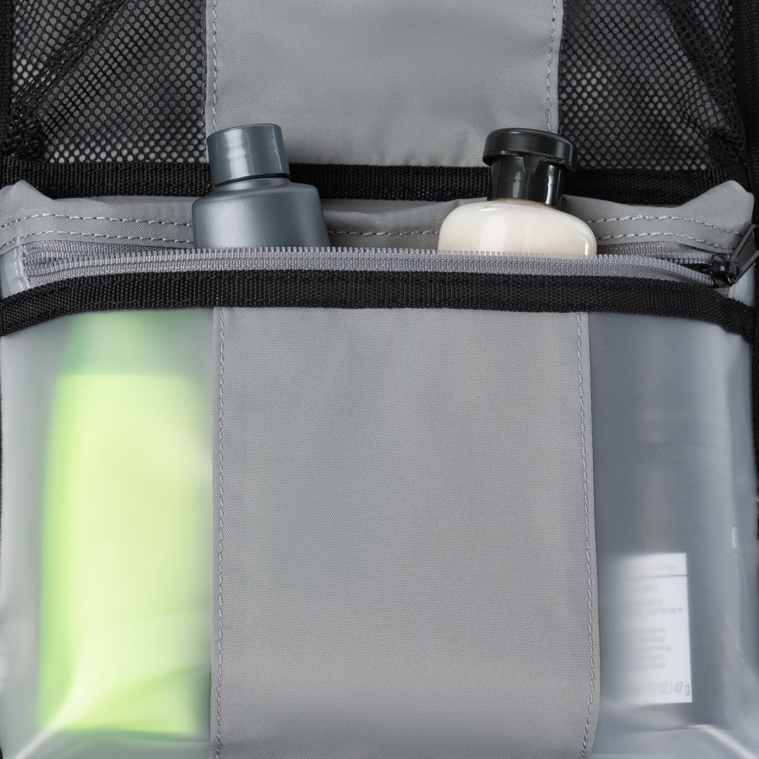 Clear pouch with toiletries , showing a close-up of the product arrangement.