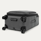 Grey suitcase with black wheels on a white background