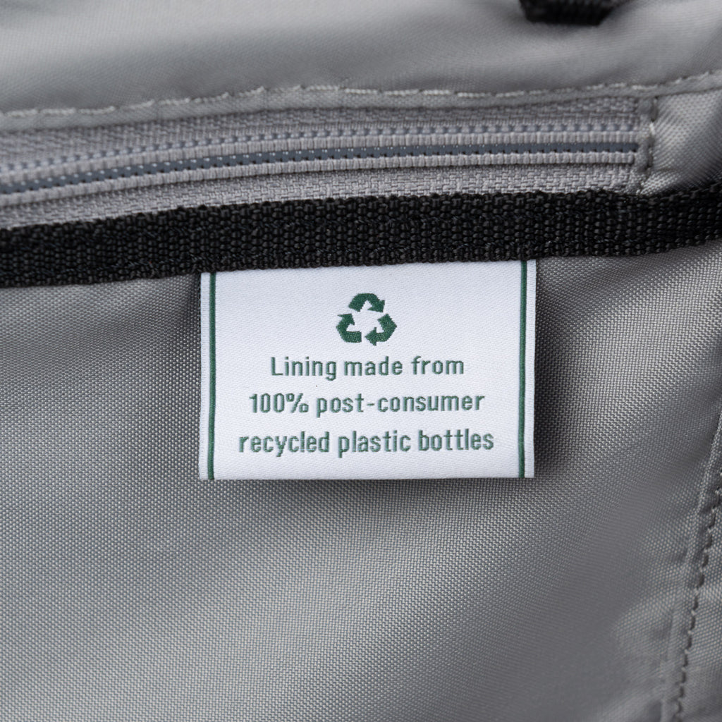 Close-up of label indicating lining made from 100% post-consumer recycled plastic bottles.
