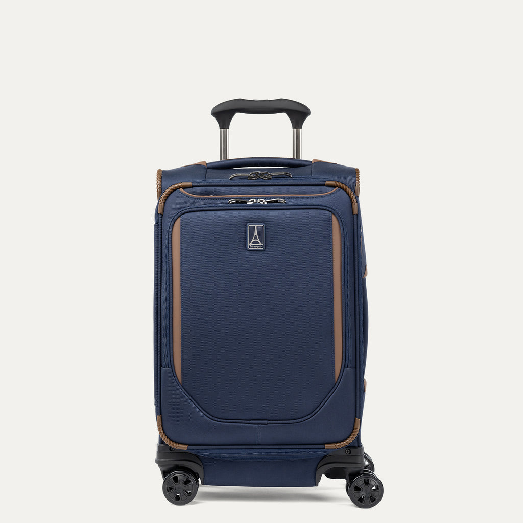 Front view of Travelpro Crew Classic Carry-On Spinner in Patriot Blue, featuring PowerScope Lite Handle and protective corner details.