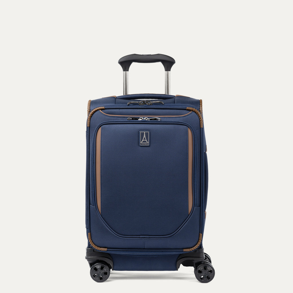 Front view of Travelpro Crew Classic  compact Carry-On Spinner in Patriot Blue, featuring PowerScope Lite Handle and reinforced corners.