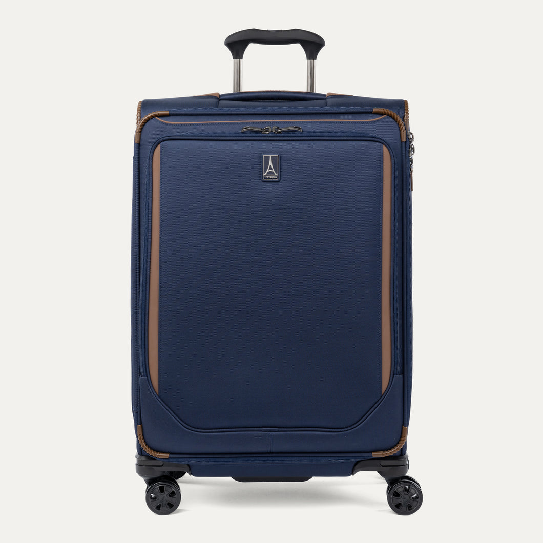 Front view of Travelpro Crew Classic Medium Check-In Expandable Spinner in Patriot Blue, featuring smooth 360° Spinner Wheels and reinforced corners.
