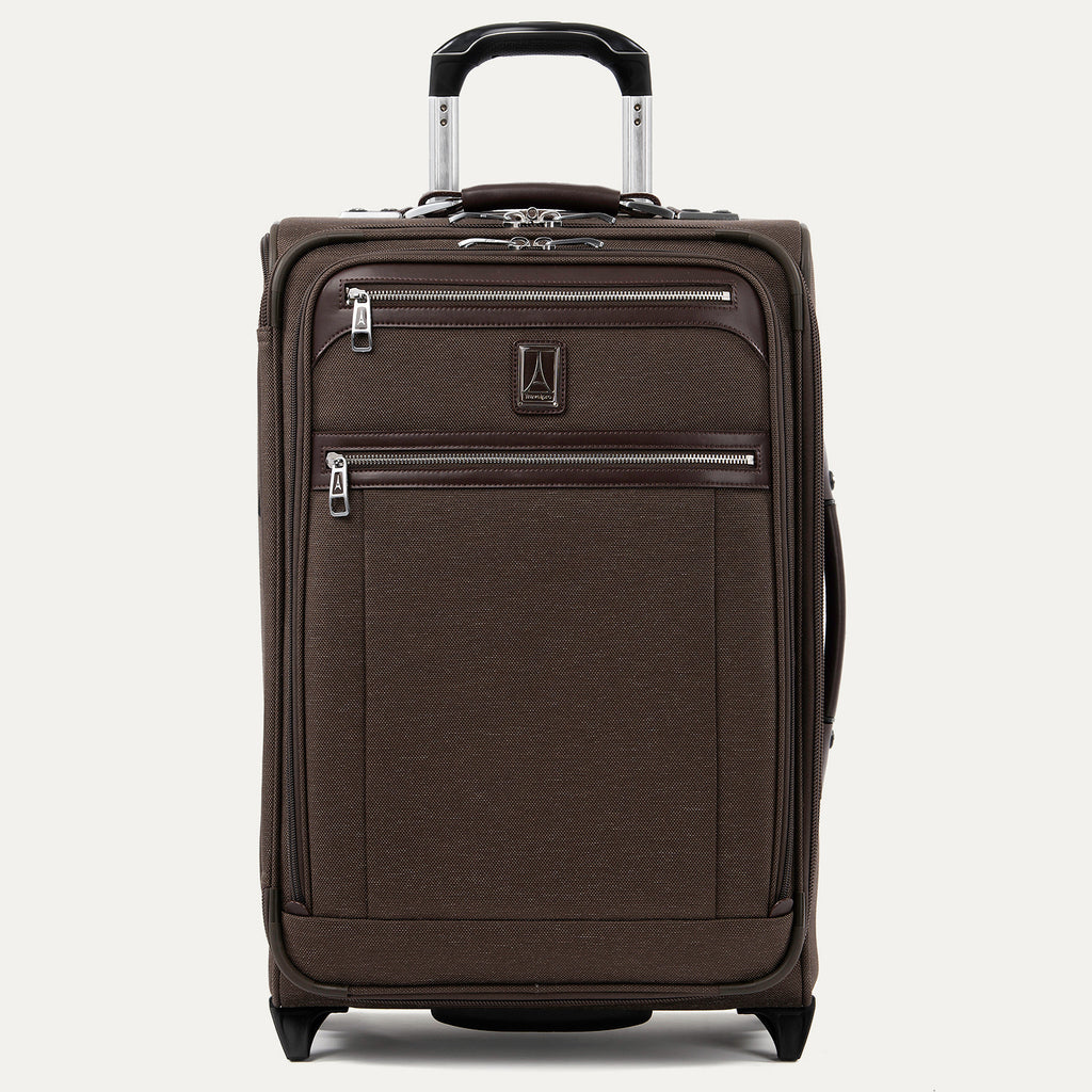 Front view of Travelpro Platinum Elite Carry-On Rollaboard in Rich Espresso, showing dual zippered front pockets, leather trim, side carry handle, and telescoping handle.
