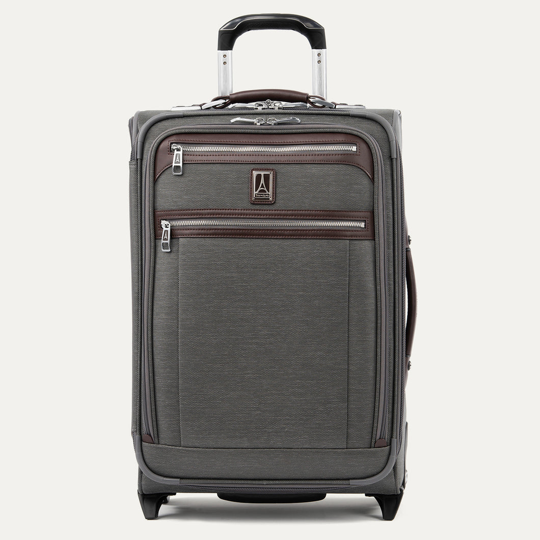 Front view of Travelpro Platinum Elite Carry-On Rollaboard in Vintage Grey, showing dual zippered front pockets, leather trim, side carry handle, and telescoping handle.
