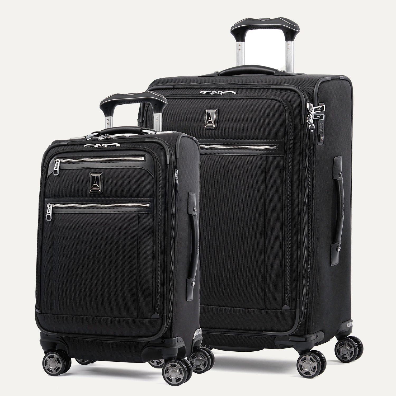 A set of two black Platinum Elite spinner suitcases, one carry-on size and one medium check-in size, with chrome zippers and TSA locks.