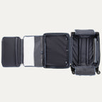 Open suitcase with open suiter compartment on a white background