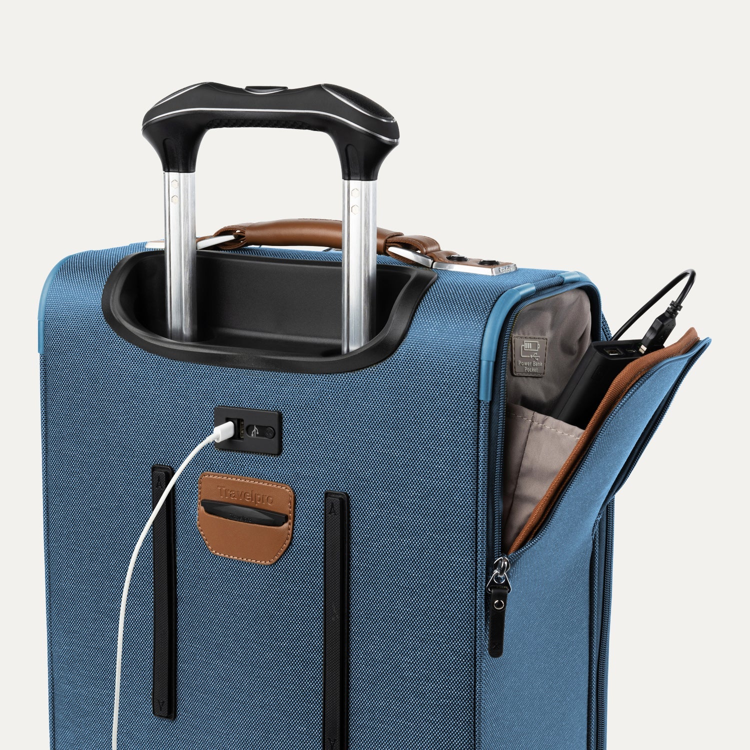 Blue suitcase with USB cable and other accessories visible on a white background 