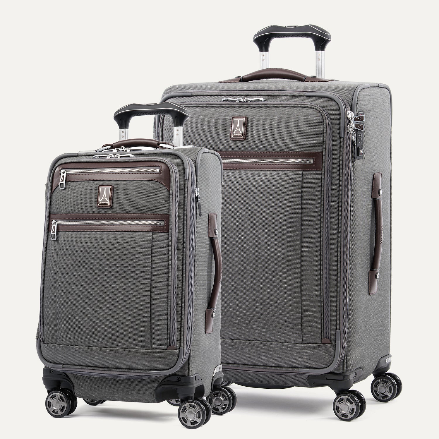Two gray suitcases with black wheels and extended handle on a white background