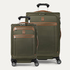 A set of two olive green Platinum Elite spinner suitcases, one carry-on and one medium check-in size, with leather accents and chrome zippers.