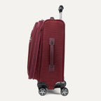 Side view of red suitcase with handles and wheels on a white background