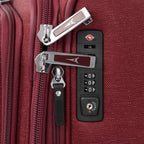 Close-up of a red suitcase with zippers and lock