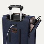 Blue suitcase with USB cable and other accessories visible on a white background